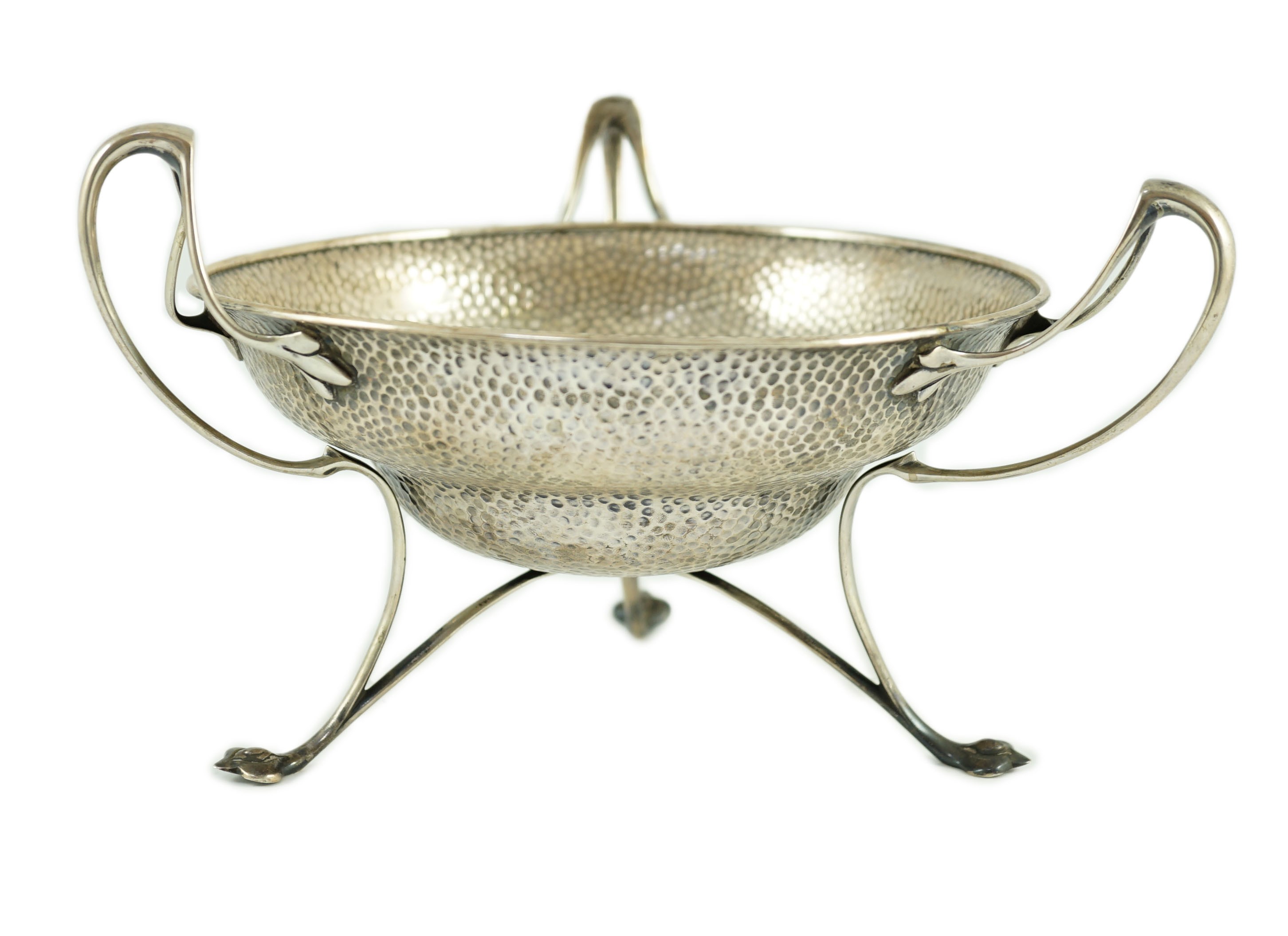 An Edwardian Art Nouveau planished silver tri-handled bowl by The Alexander Clark Manufacturing Co.